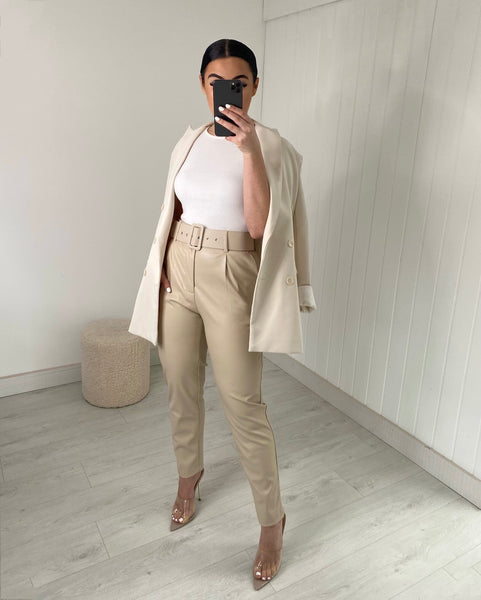 BEIGE BELTED VEGAN LEATHER TROUSERS