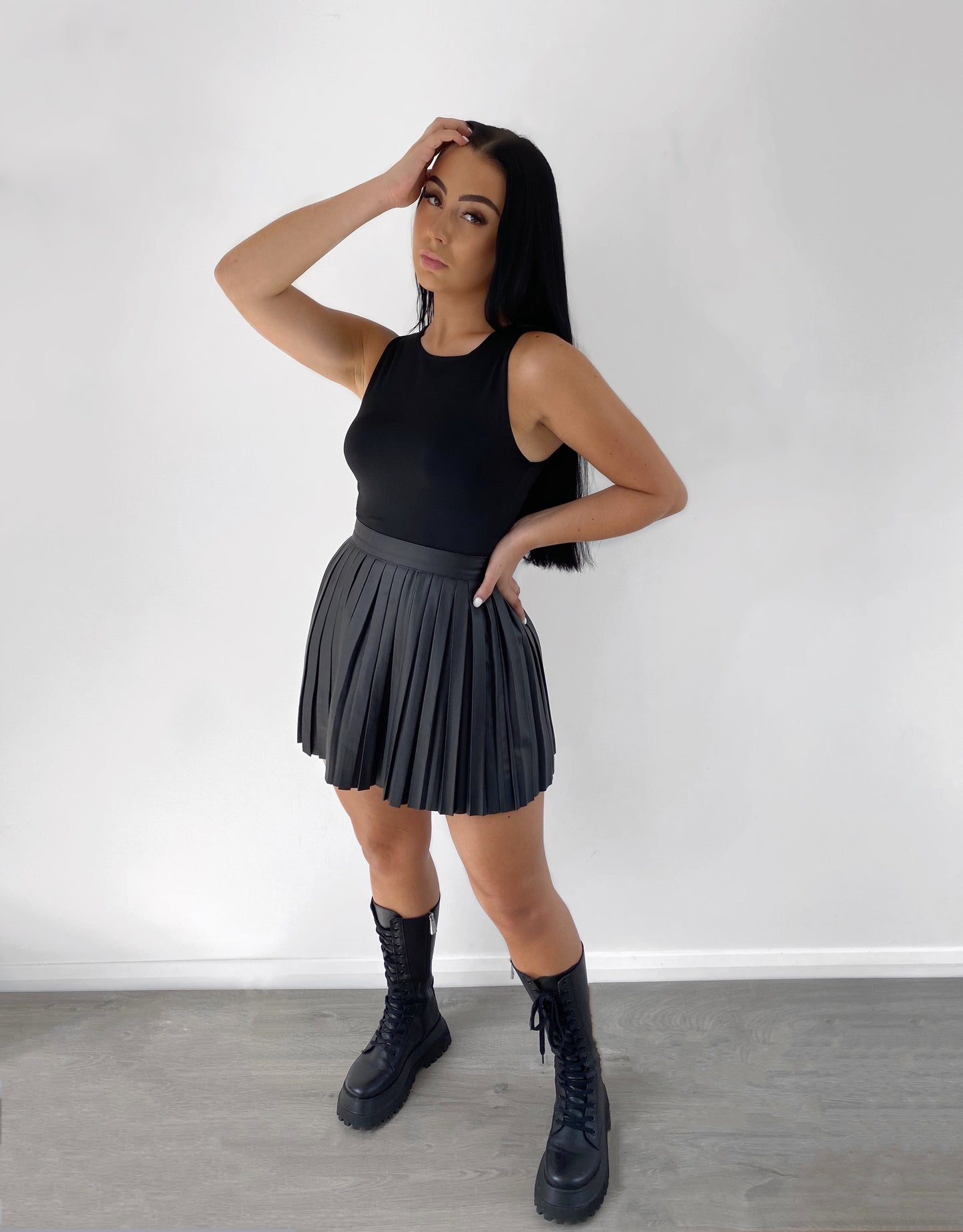 BLACK VEGAN LEATHER PLEATED SKIRT