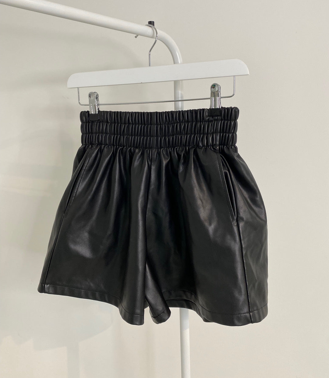 BLACK FLARE VEGAN LEATHER SHORTS